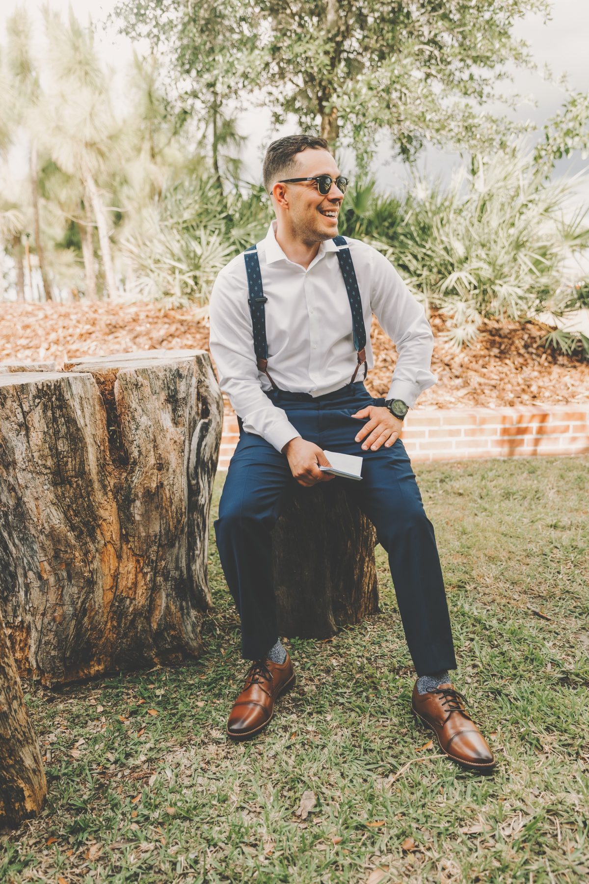 A groom enjoying a quiet moment on the estate before his ceremony